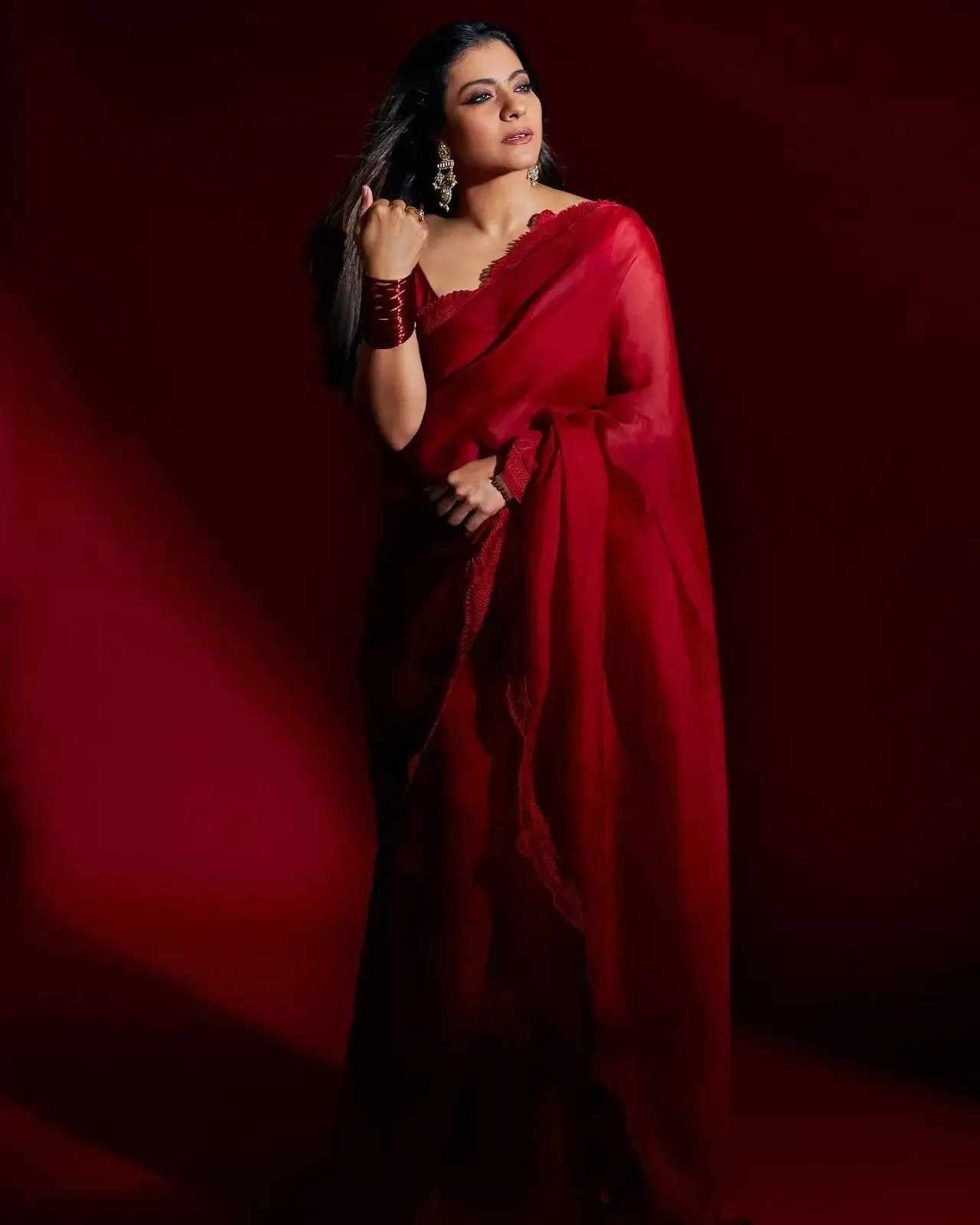 North Indian actress Kajol Devgn in Sleeveless Maroon Color saree